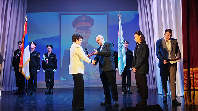 Награду принял отец